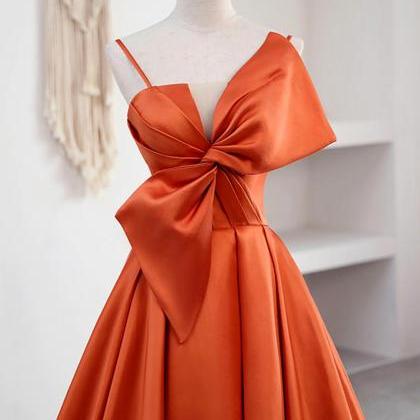 Elegant Orange Satin Gown With Sculptural Bow..