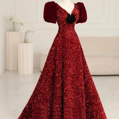 Ruby Red Sequin Gown With Velvet Accents And Puff..