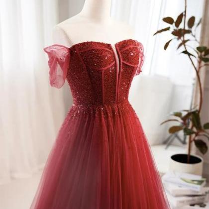 Enchanting Burgundy Tulle Gown With Beaded Corset..