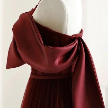 Burgundy Tulle Gown With Dramatic Bow Accent
