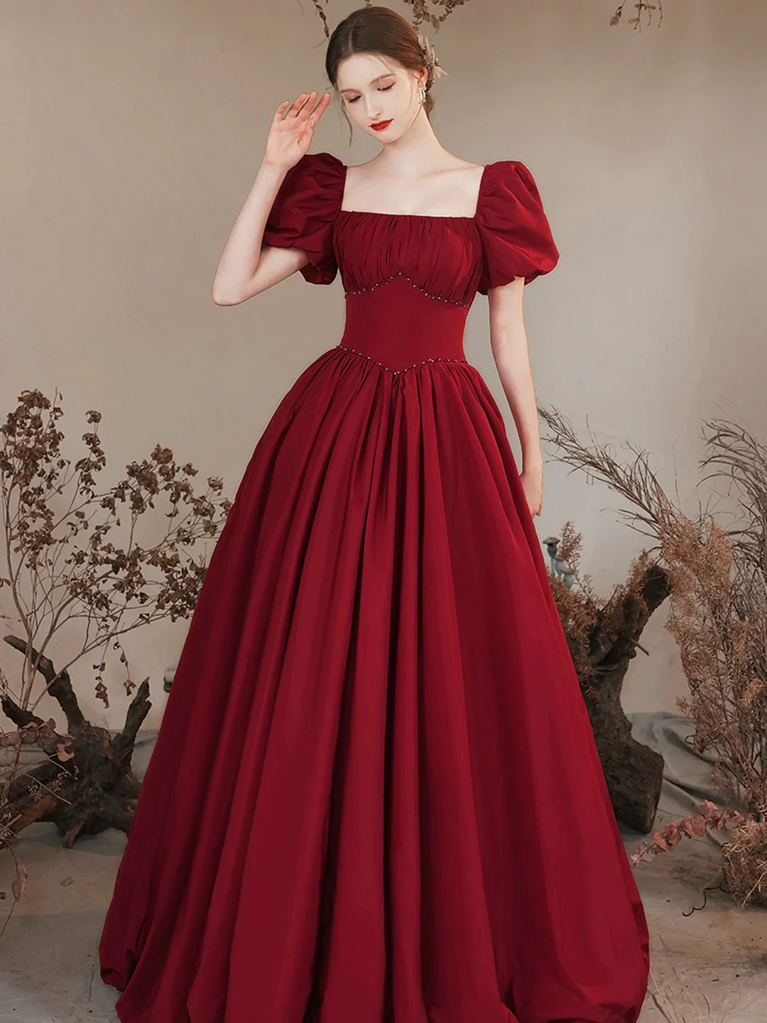 A-line Burgundy Puff Sleeve Ball Gown With Beaded Waist Detail A-line Burgundy Puff Sleeve Ball Gown With Beaded Waist Detail