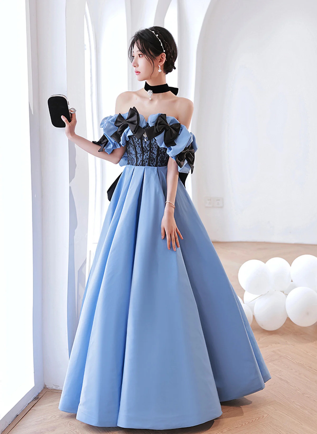 Elegant Off-shoulder Blue Evening Gown With Black Bow Accents