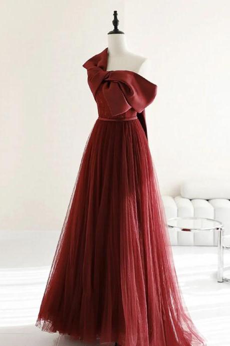 Burgundy Tulle Gown With Dramatic Bow Accent